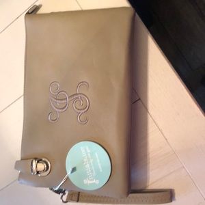 Initials inc cross body purse. Never been used.